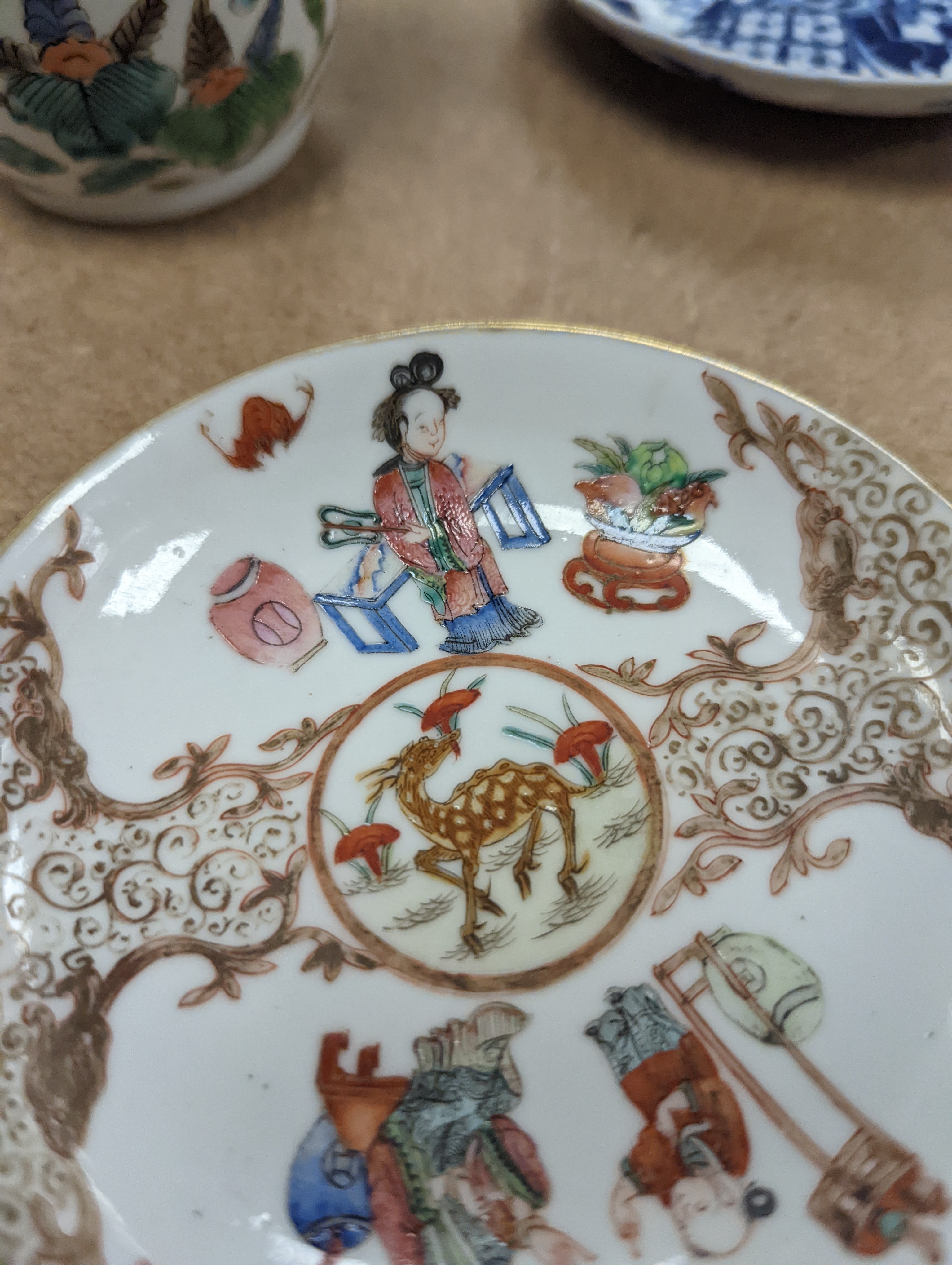 Two Chinese porcelain saucers, and a Chinese enamelled porcelain vase, 12.5cm., 18th century and later